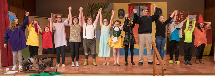 Group programs include theater classes where students celebrate a successful show.