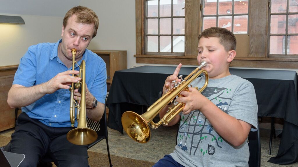 A beginner from west of Worcester takes a trumpet lesson